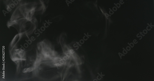 water mist over black background