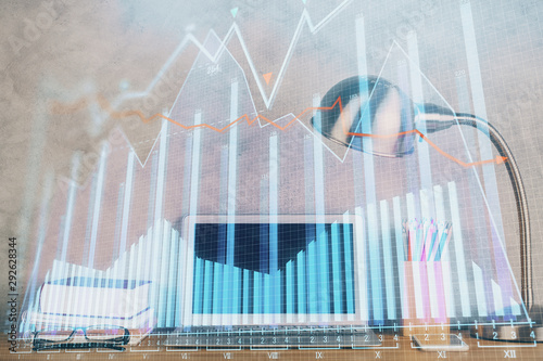 Double exposure of forex graph and work space with computer. Concept of international online trading. © peshkova