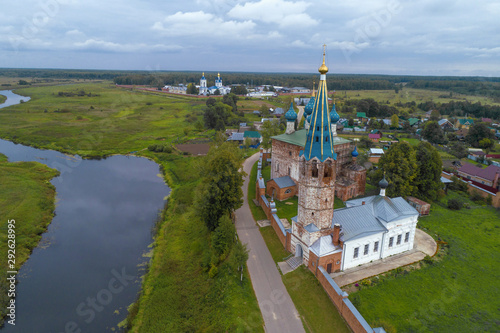 View of the ancient temples of the village of Dunilovo on a cloudy September day. Ivanovo region, Russia photo