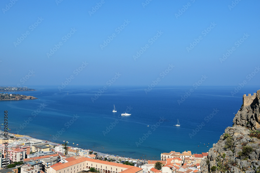View of Cefalu town from the rock of Rocca di Cefalu in the morning. Sicily, Italy