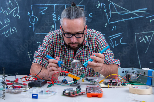 Tech postgraduate student working on electronic project