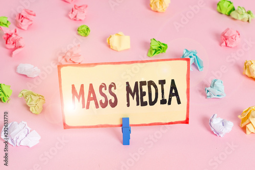 Conceptual hand writing showing Mass Media. Concept meaning Group showing making news to the public of what is happening Colored crumpled papers empty reminder pink floor clothespin