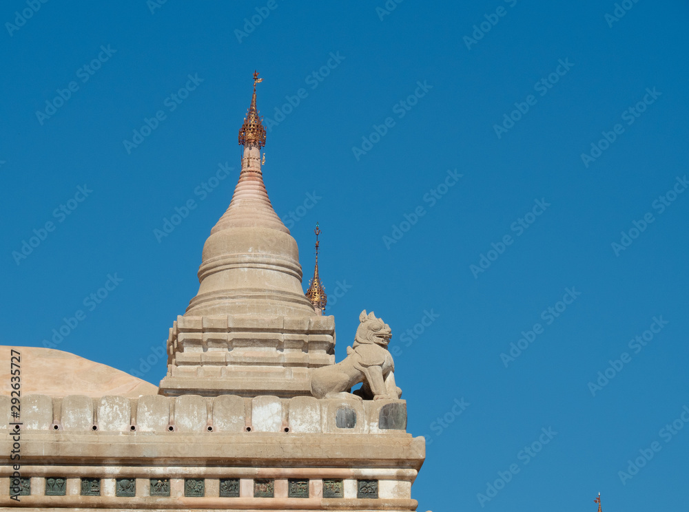 Exterior of Ananda temple in Bagan, Myanmar, Chinthe and small stupa. Beautiful and elegant building with well preserved. Exterior of Ananda temple in Bagan, Myanmar, Chinthe and small stupa. Beautiful and elegant building with well preserved.