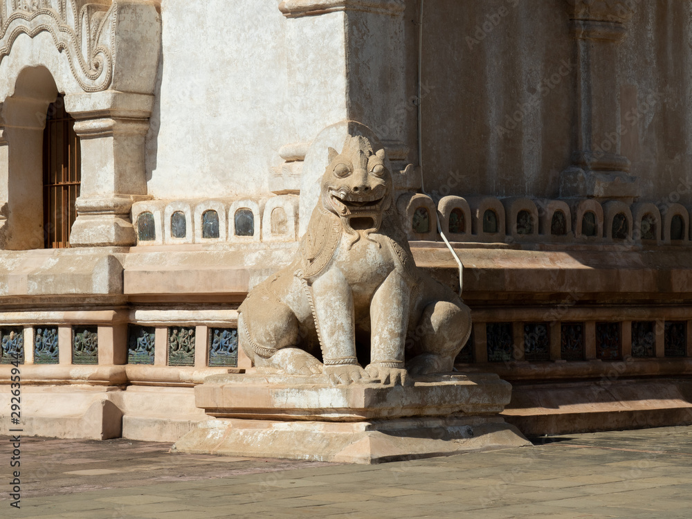 Statue of Chinthe or Leogryph with double -body sitting at the corner of Ananda Temple, Myanmar. Chinthe statue always seen in Myanmar temples as guardian.
