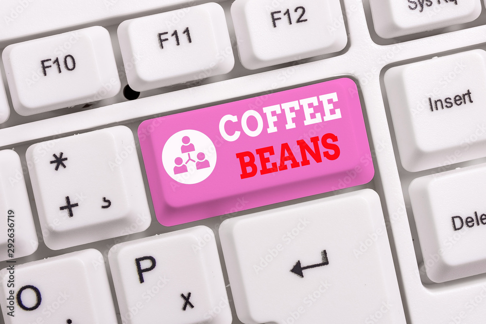 Conceptual hand writing showing Coffee Beans. Concept meaning pit inside the red or purple fruit often referred as a cherry White pc keyboard with note paper above the white background Conceptual hand writing showing Coffee Beans. Concept meaning pit inside the red or purple fruit often referred as a cherry White pc keyboard with note paper above the white background