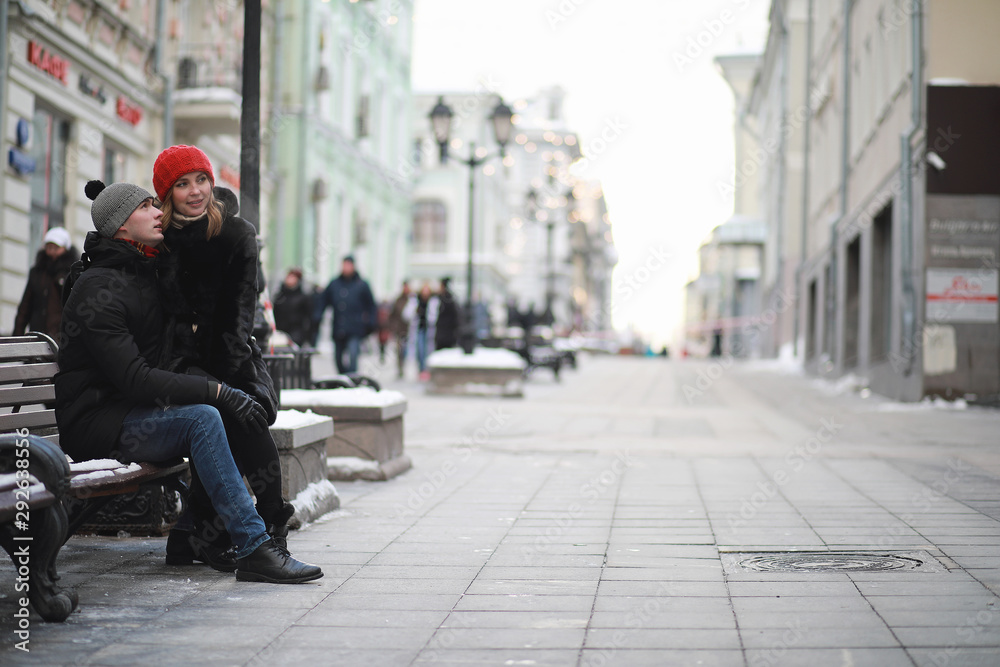 Young couple walking through the winter