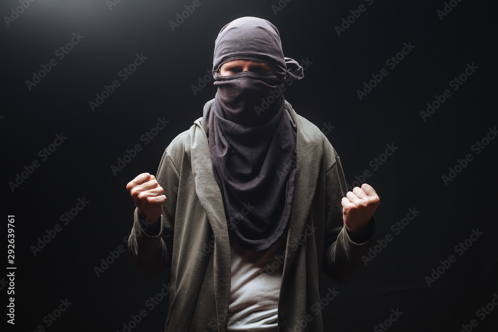 masked criminals with fists on a dark background masked criminals with fists on a dark background