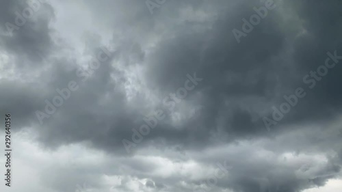 dramatic big storming dark rain clouds on sky timelapse