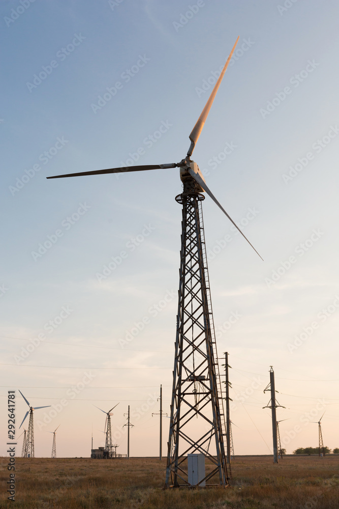 several turbo generators against the evening sky, clean energy concept, close-up several turbo generators against the evening sky, clean energy concept, close-up