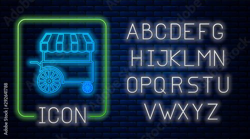 Glowing neon Fast street food cart with awning icon isolated on brick wall background. Urban kiosk. Neon light alphabet. Vector Illustration