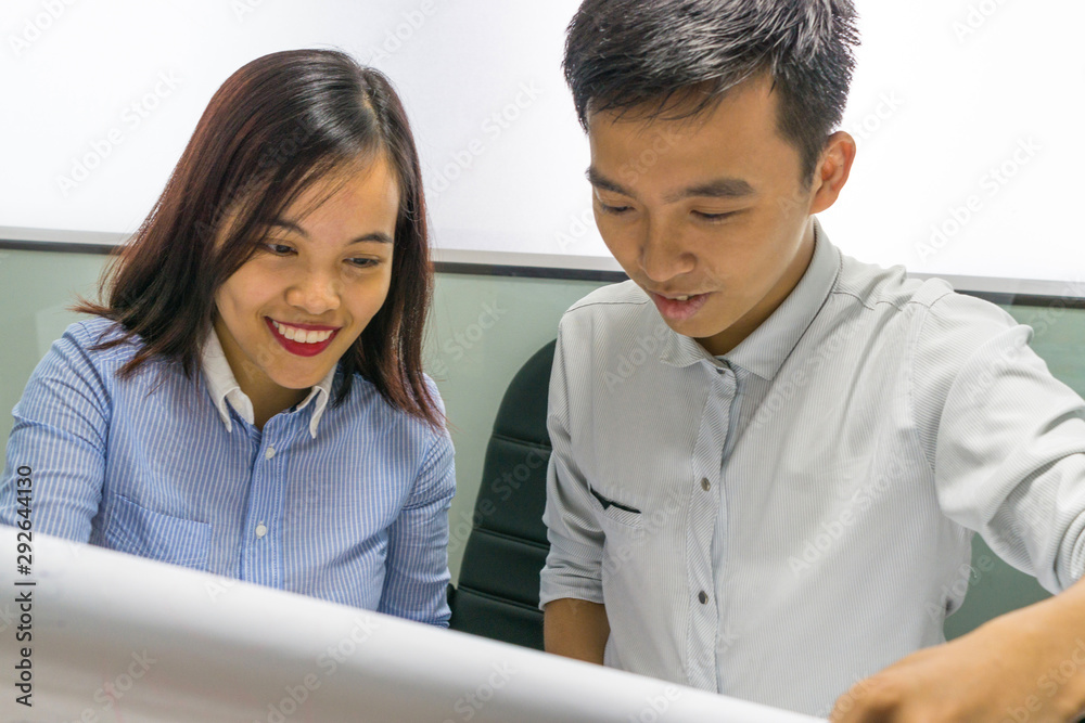 Asian business employees discuss about work on paper Asian business employees discuss about work on paper