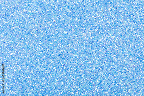 Glitter background for your excellent design in light tone, new shiny blue Christmas texture.