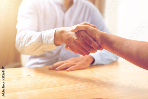 Image of asian business handshaking after good deal at office. meeting concept.