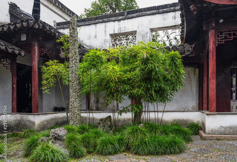 A corner with rockery pillar and bamboo in Master of the Nets Garden or Wangshi Garden in Suzhou, China, among the finest gardens in China and UNESCO World Heritage Site.