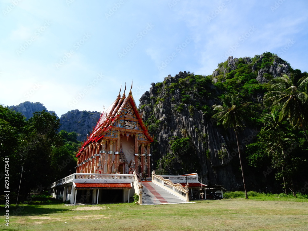 Lost temple in a rural village of Thailand. Mountains and tropical forest on the background. Lost temple in a rural village of Thailand. Mountains and tropical forest on the background.