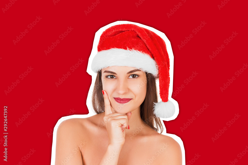 Young adult girl with wearing christmas hat. Smiling with thoughtful face. Magazine collage style with trendy color background. Happy Christmas and New Year holidays concept Young adult girl with wearing christmas hat. Smiling with thoughtful face. Magazine collage style with trendy color background. Happy Christmas and New Year holidays concept