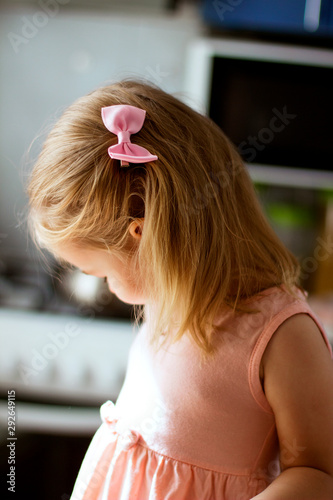 little girl with a bow in her hair