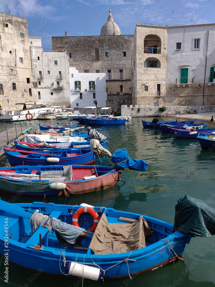 Small port with fishing boats in the city of  Monopoli in Italy