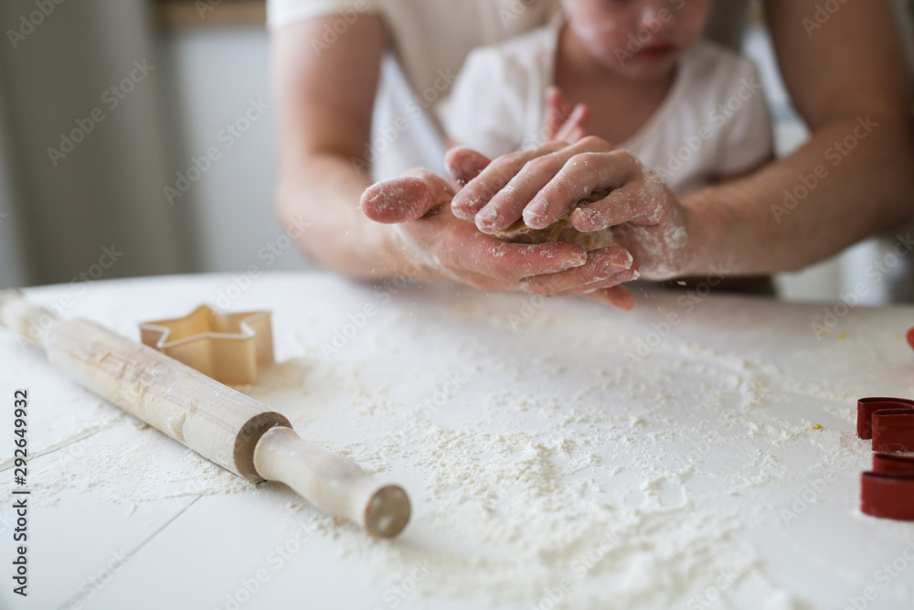 girl with Down syndrome with family in the kitchen girl with Down syndrome with family in the kitchen