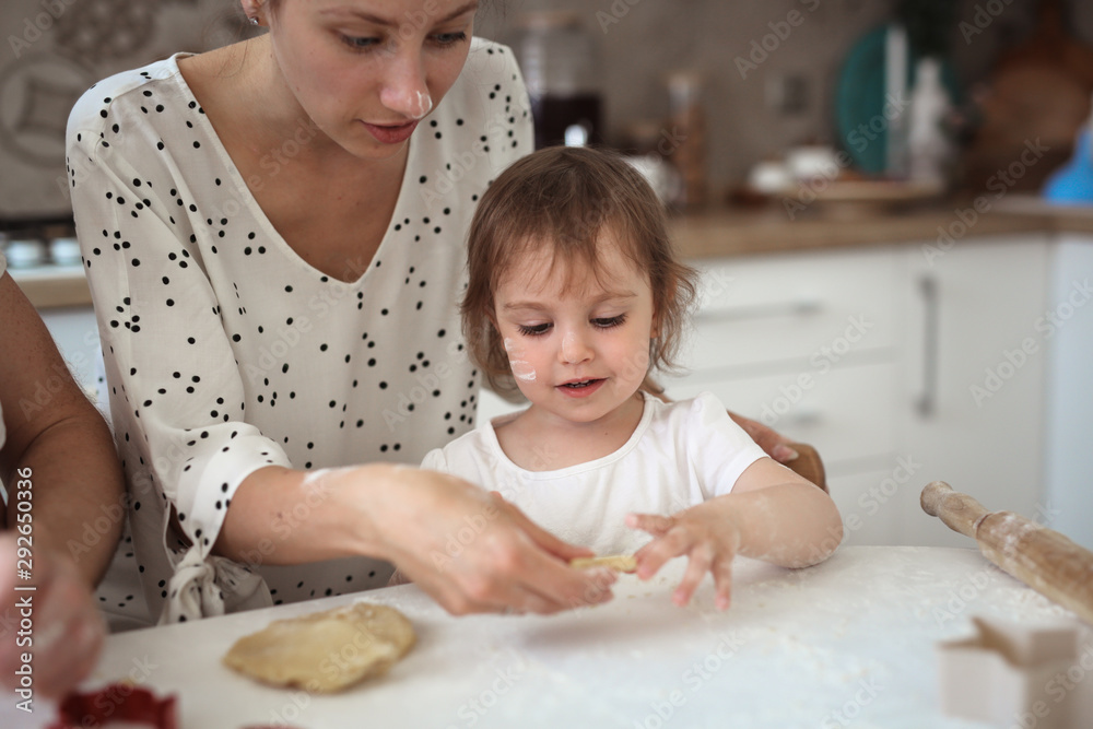 Mom and daughter Toddler together make cookies Mom and daughter Toddler together make cookies