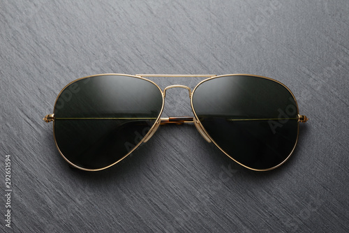 Classic sunglasses on black slate background