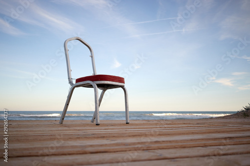 chair facing the sea concept of future and loneliness