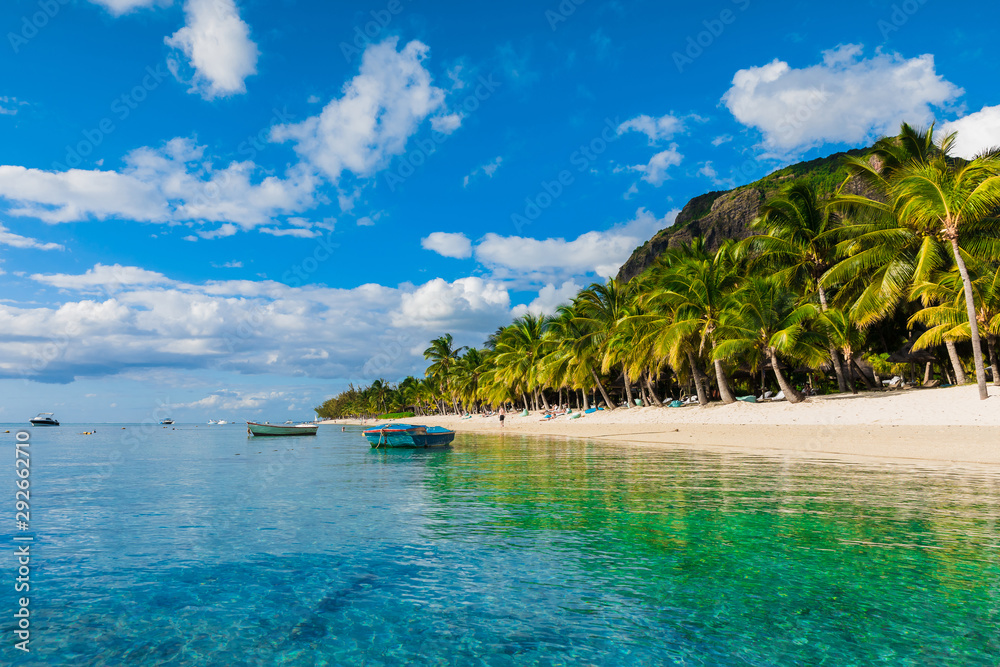 Fototapeta premium Beautiful view of the luxury beach in Mauritius. Transparent ocean, white sand beach, palms and sky
