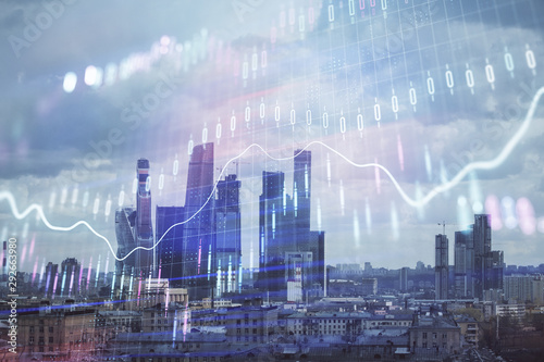 Double exposure of financial graph on downtown veiw background. Concept of stock market research and analysis