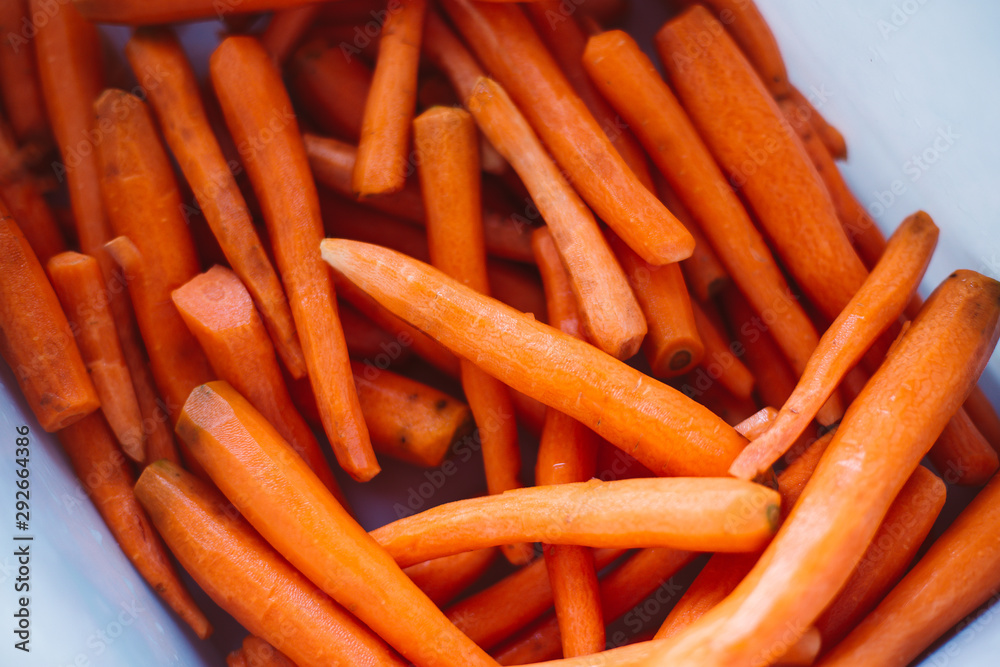 Lot of peeled carrots for carrot juice. Raw vegan food. Autumn harvest. Lot of peeled carrots for carrot juice. Raw vegan food. Autumn harvest.
