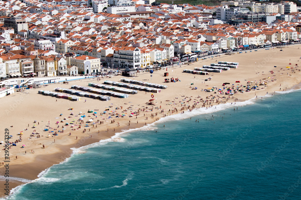 Red and Orange roofs of Nazare fishing village captured from Upper Town in Nazare, Portugal