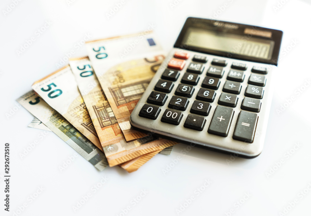 Banknotes and Calculator, Euro Banknotes on White Background Banknotes and Calculator, Euro Banknotes on White Background