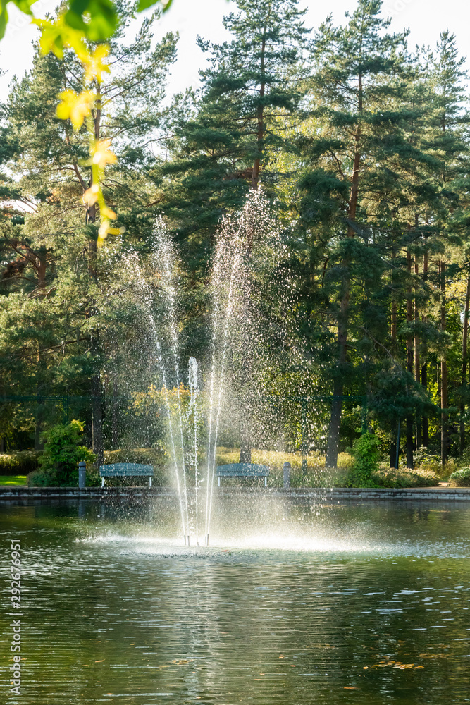 custom made wallpaper toronto digitalA park in the city center with a pond and a fountain, Kouvola, Finland