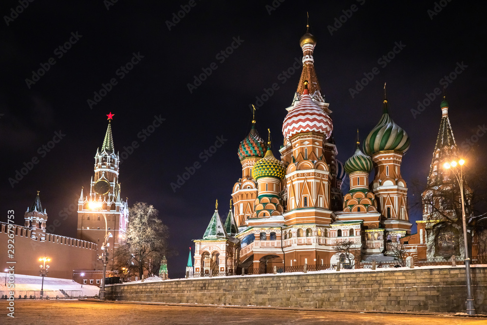 Evening Moscow. St. Basil's Cathedral with multi-colored domes. Cathedral on red square. Kremlin. View of the Russian capital in the evening. Black sky over Moscow. Symbol of Russia.