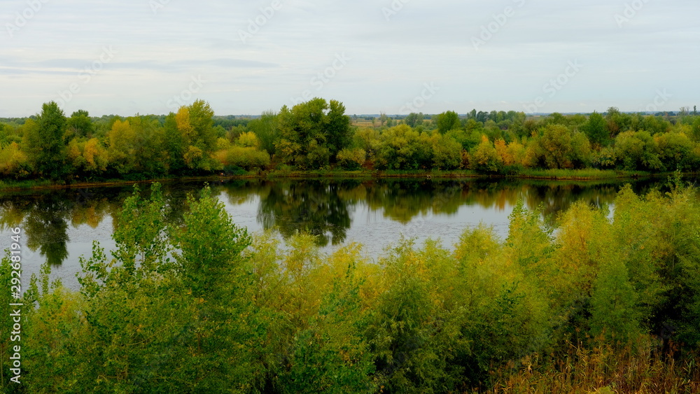  Lake in the forest. Reflection of trees in the water