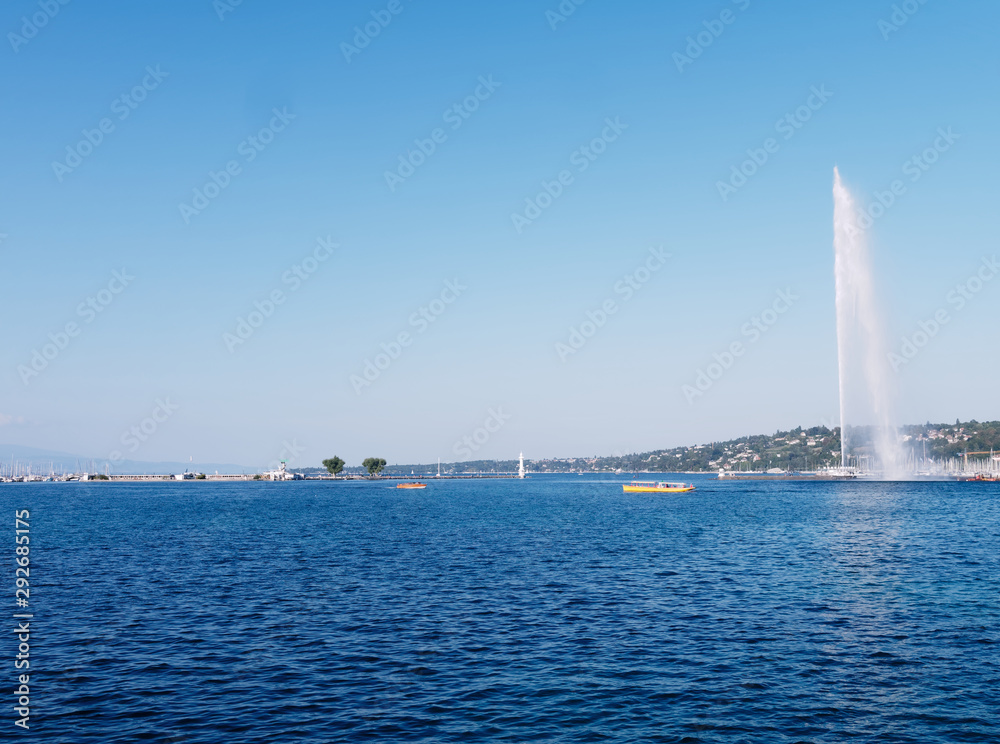 Famous Jet d'Eau fountain of the Geneva lake on a sunny day in Switzerland.