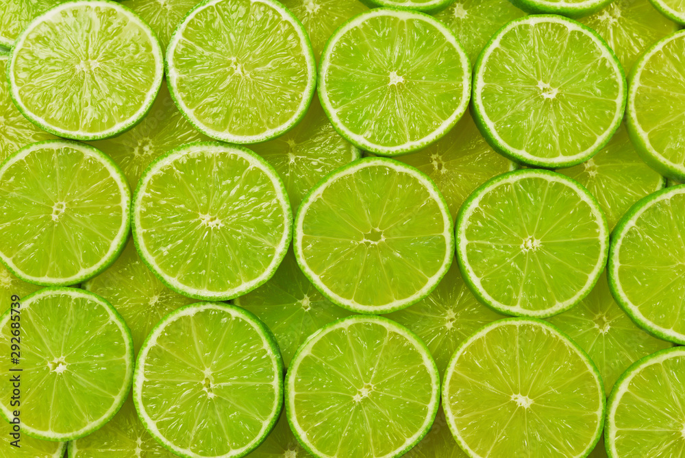 Fresh lime slices as a background.