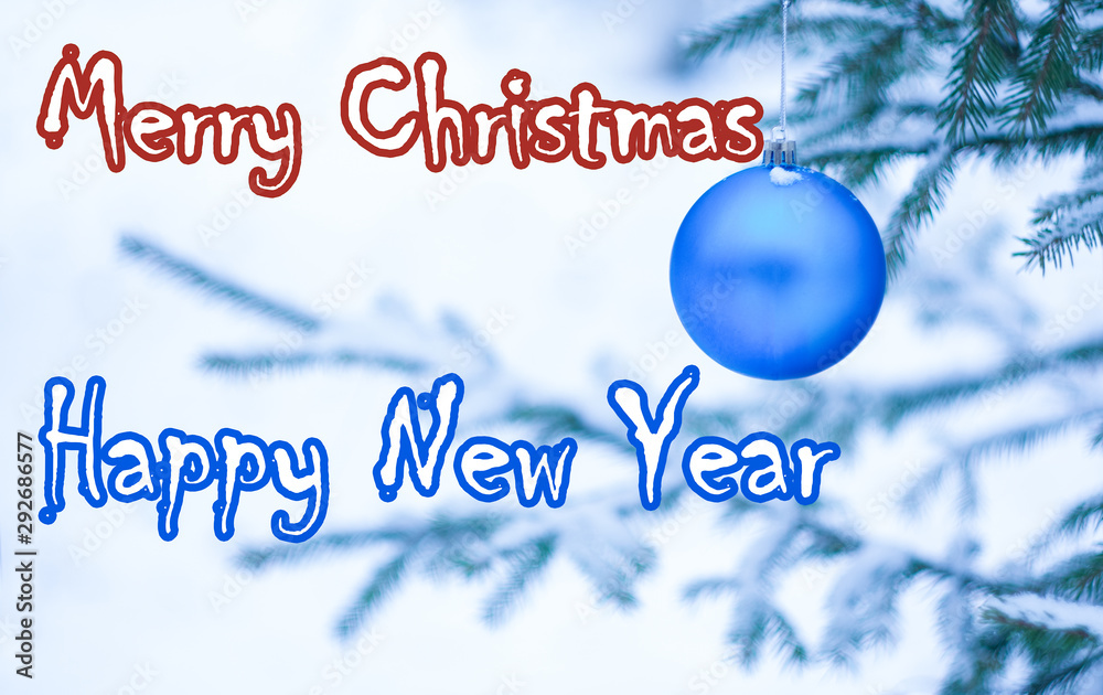 Christmas greeting card with a blue ball on the tree and the inscription