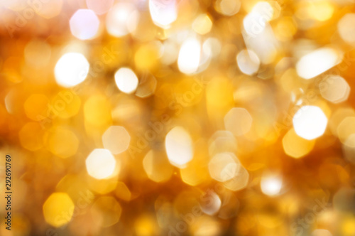 Beautiful blurred festive golden yellow orange bokeh