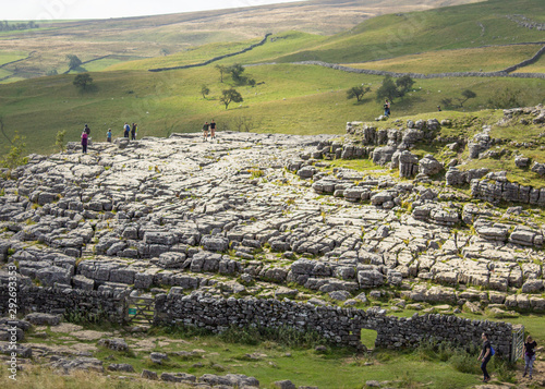 Fotografering The famous limestone pavement above Malham Cove from which hikers get stunning v