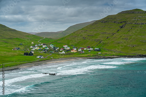Fényképezés Husavik village near the coast in Sandoy island, Faroe Islands