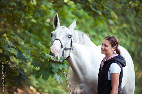 Fototapet Pretty young teenage girl with her favorite gray horse