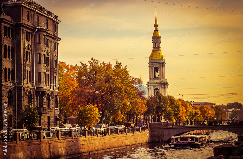 autumn city, walk in the city, walk along the waterfront, canal in the city, Church and autumn Park, river boat trip