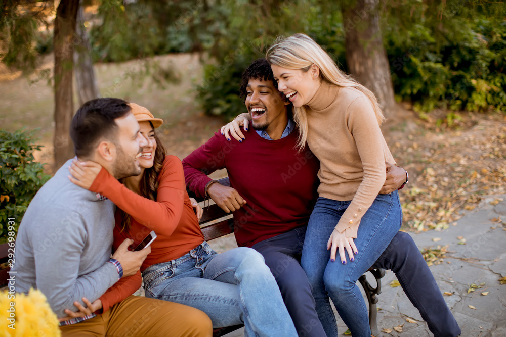 Group of young multiethnic friends having fun at park Group of young multiethnic friends having fun at park