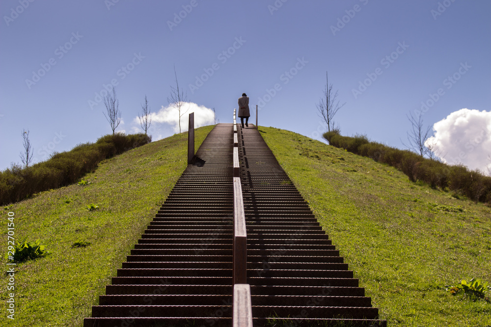 Man lonely climbs the stairs to heaven