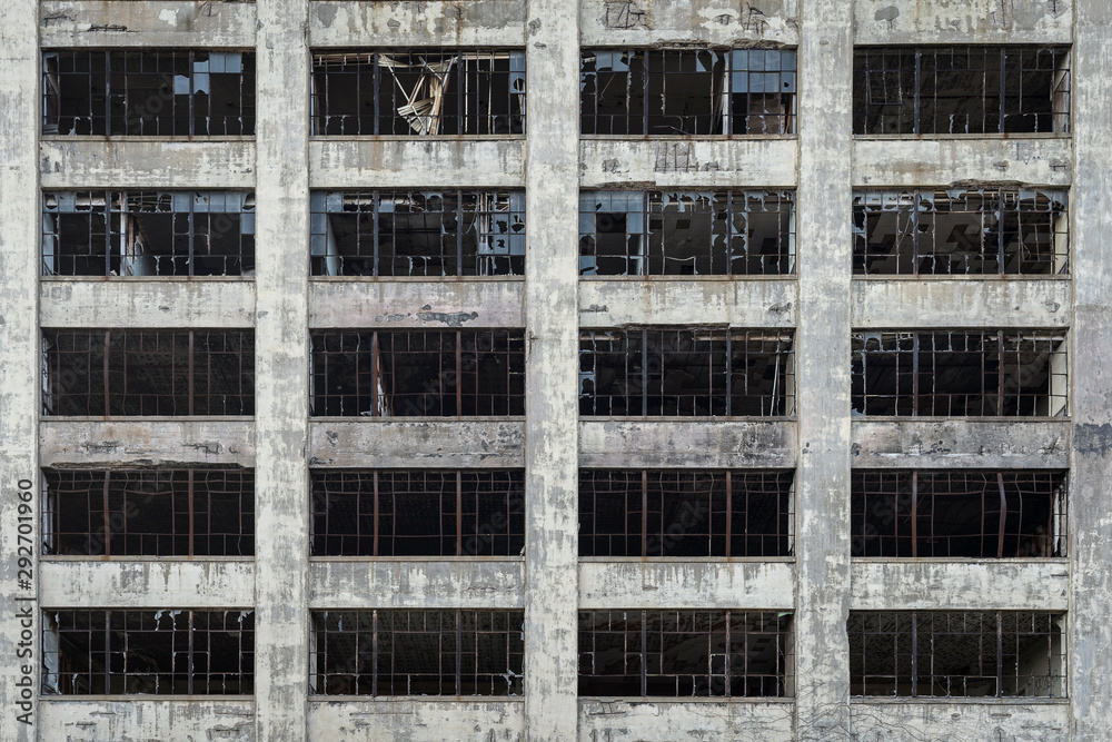 View of an old abandoned building with broken windows in Detroit Michigan