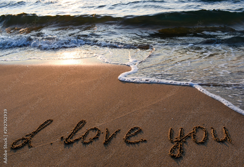 Fototapeta premium The inscription on the sand love you.