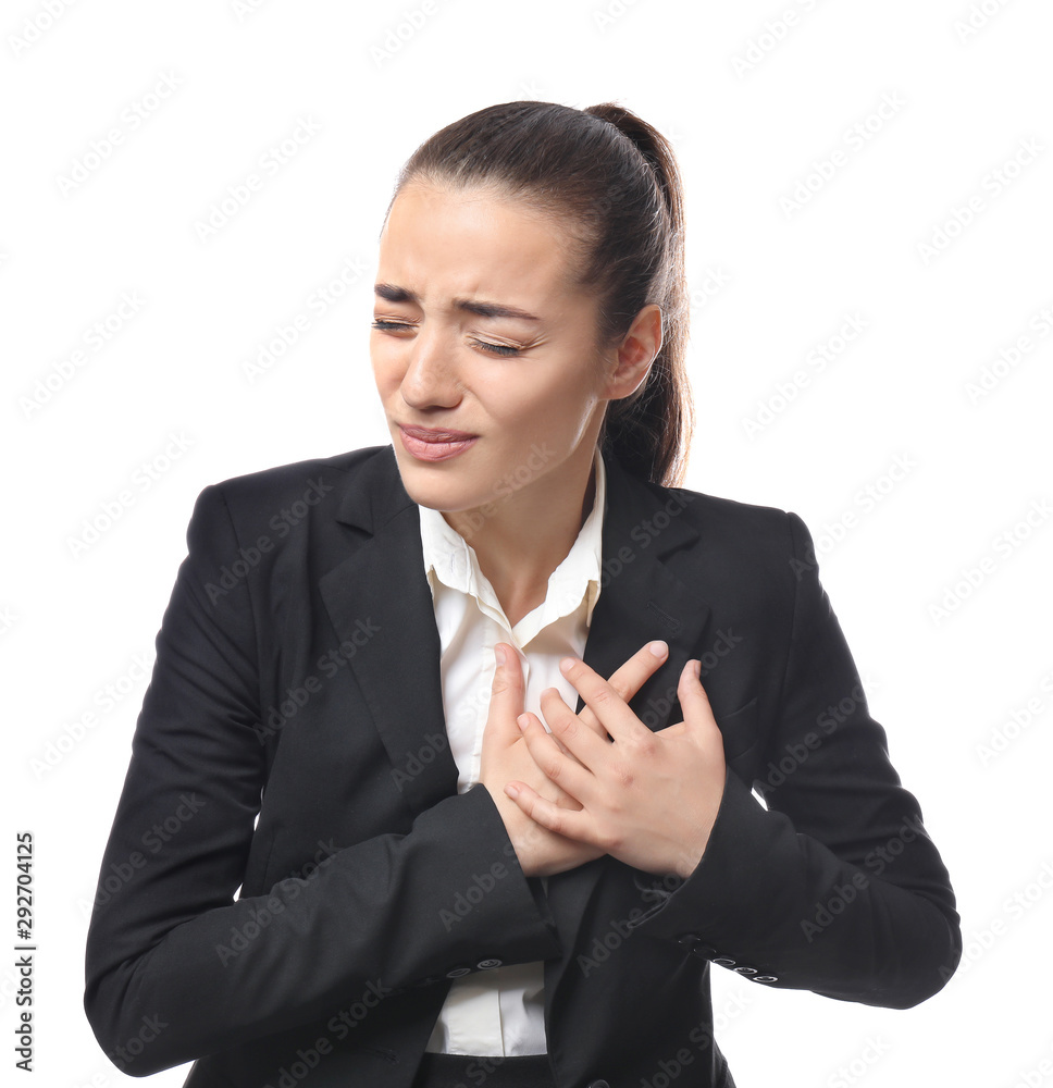 Young businesswoman suffering from heart attack on white background Young businesswoman suffering from heart attack on white background
