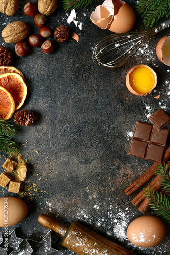 Christmas culinary background with ingredients and props for baking. Top view with copy space.