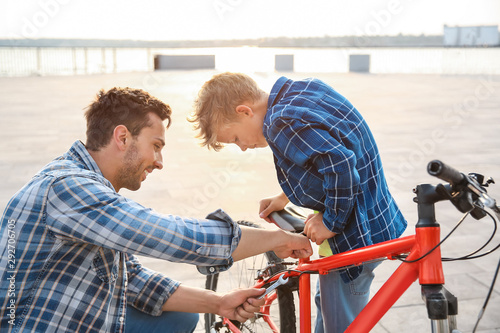 Father and his son repairin...