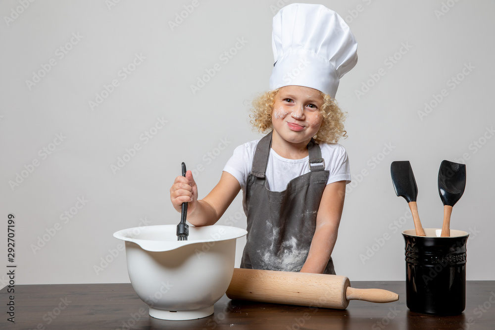 little girl in chefs hat baking covered in flour little girl in chefs hat baking covered in flour